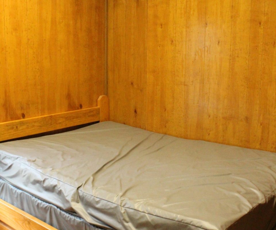 interior view of a cabin bedroom at Great Escapes RV Resorts Branson
