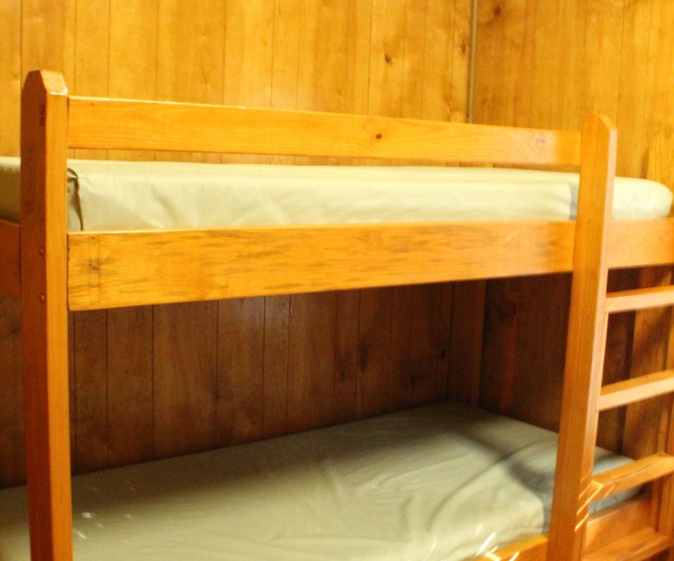 interior view of a cabin bedroom at Great Escapes RV Resorts Branson