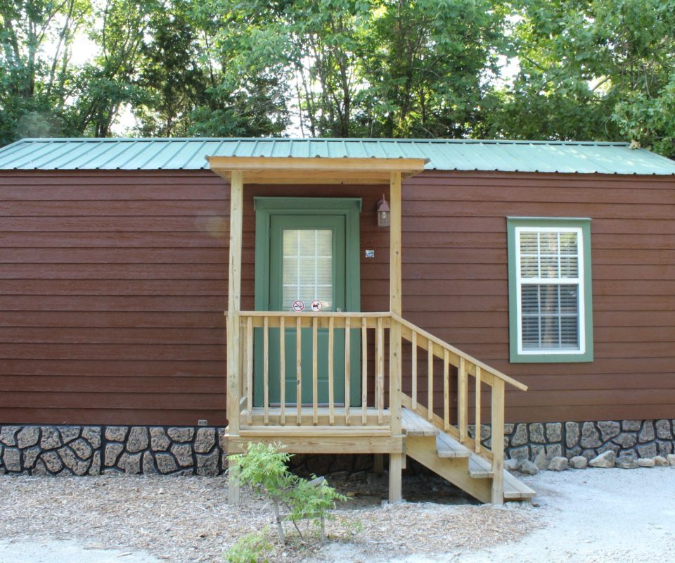 exterior view of a cabin door at Great Escapes RV Resorts Branson