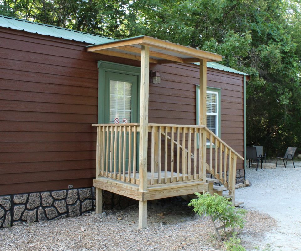 exterior view of a cabin door at Great Escapes RV Resorts Branson