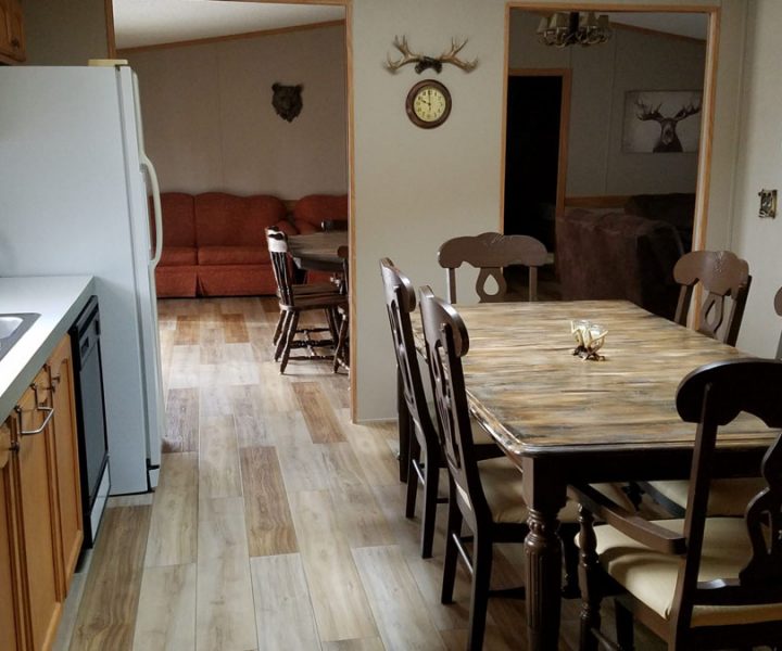 ozark house dining area with dining table kitchen area