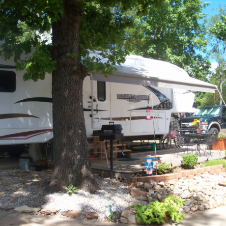 parked rv in tree shade