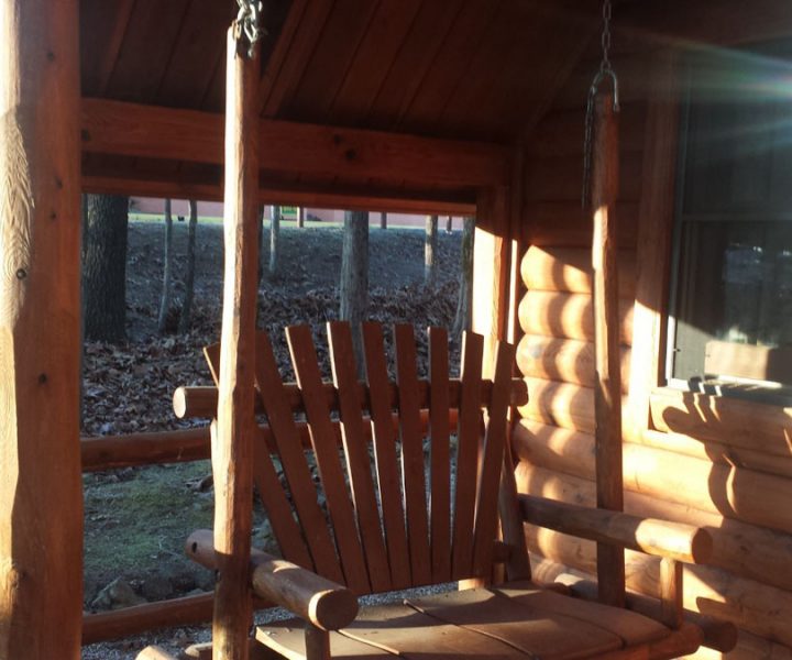 talking rocks cabin exterior view of swinging chair