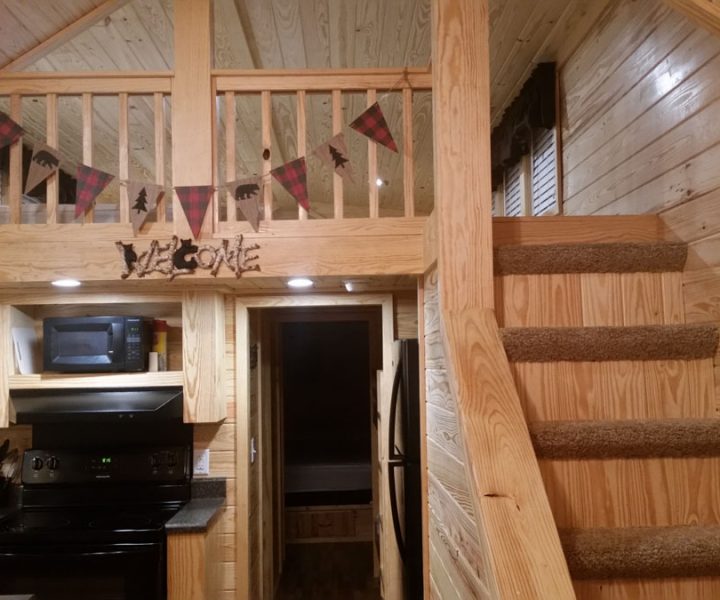 white river cabin interior with carpeted staircase