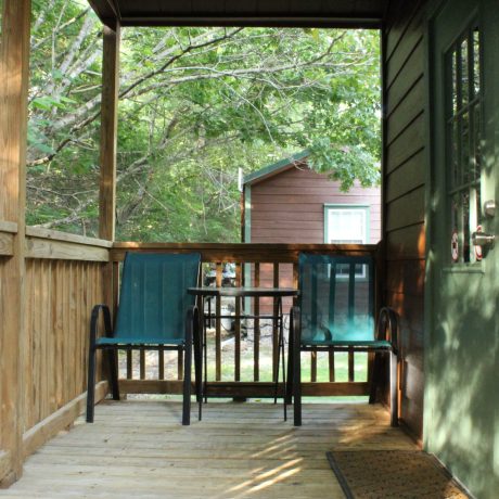 view of cabin porch at Great Escapes RV Resorts Branson