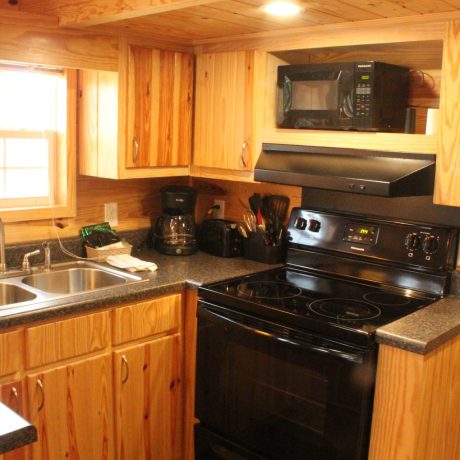 interior view of cabin kitchen at Great Escapes RV Resorts Branson