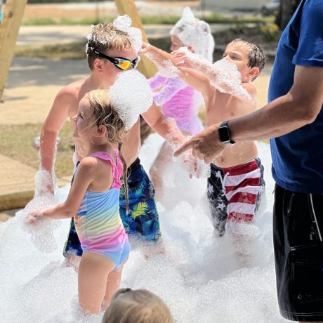 kids playing in bubbles | amenity at Great Escapes RV Resorts Branson MO