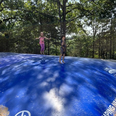 kids jumping on jumping pillow at Great Escapes RV Resorts Branson