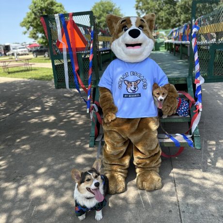 Biscuit the camp mascot at the wagon ride with a dog Great Escapes RV Resorts Branson
